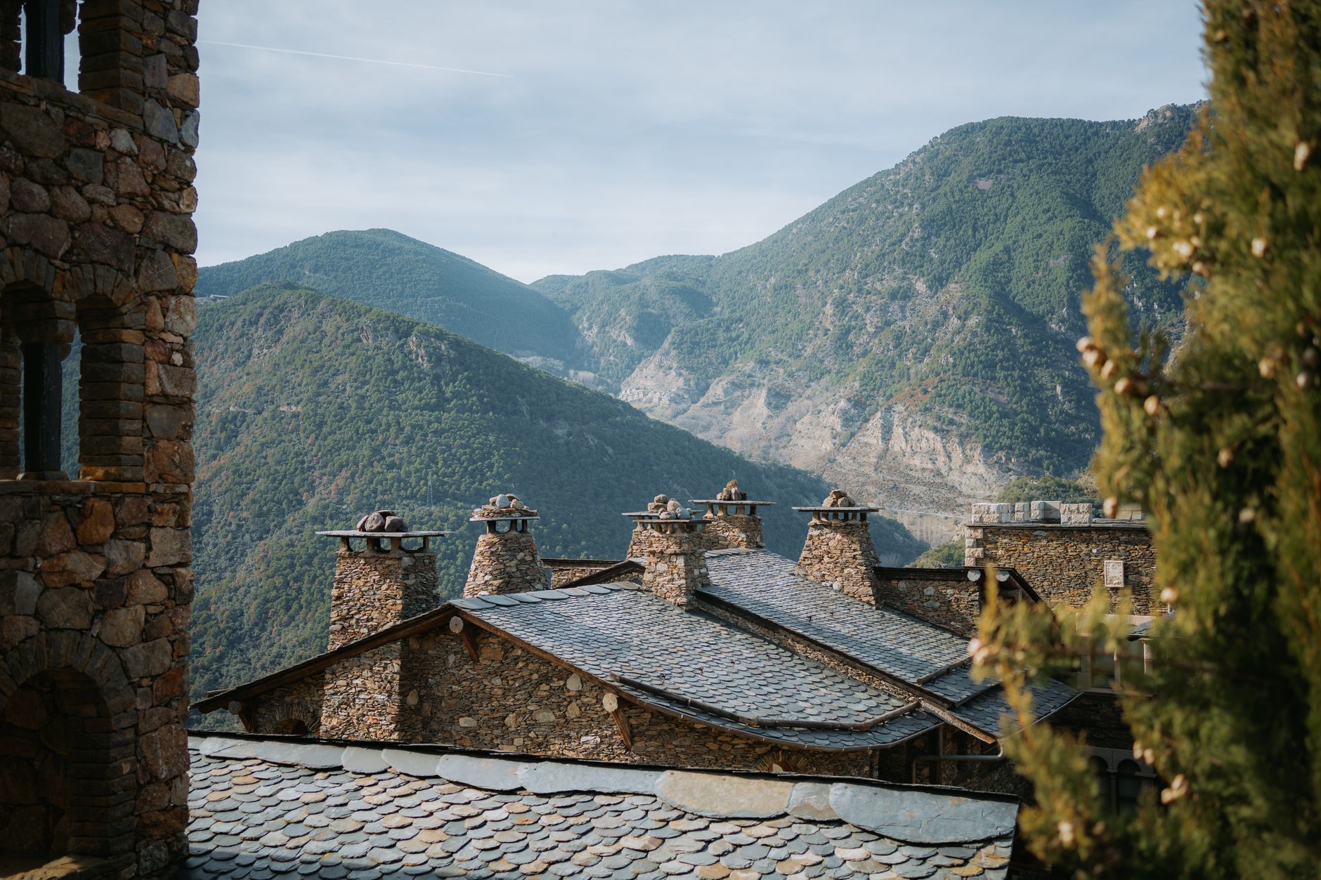 Medieval stone houses nestled among Andorra's majestic mountains. — photograph by Diogo Miranda on Pexels