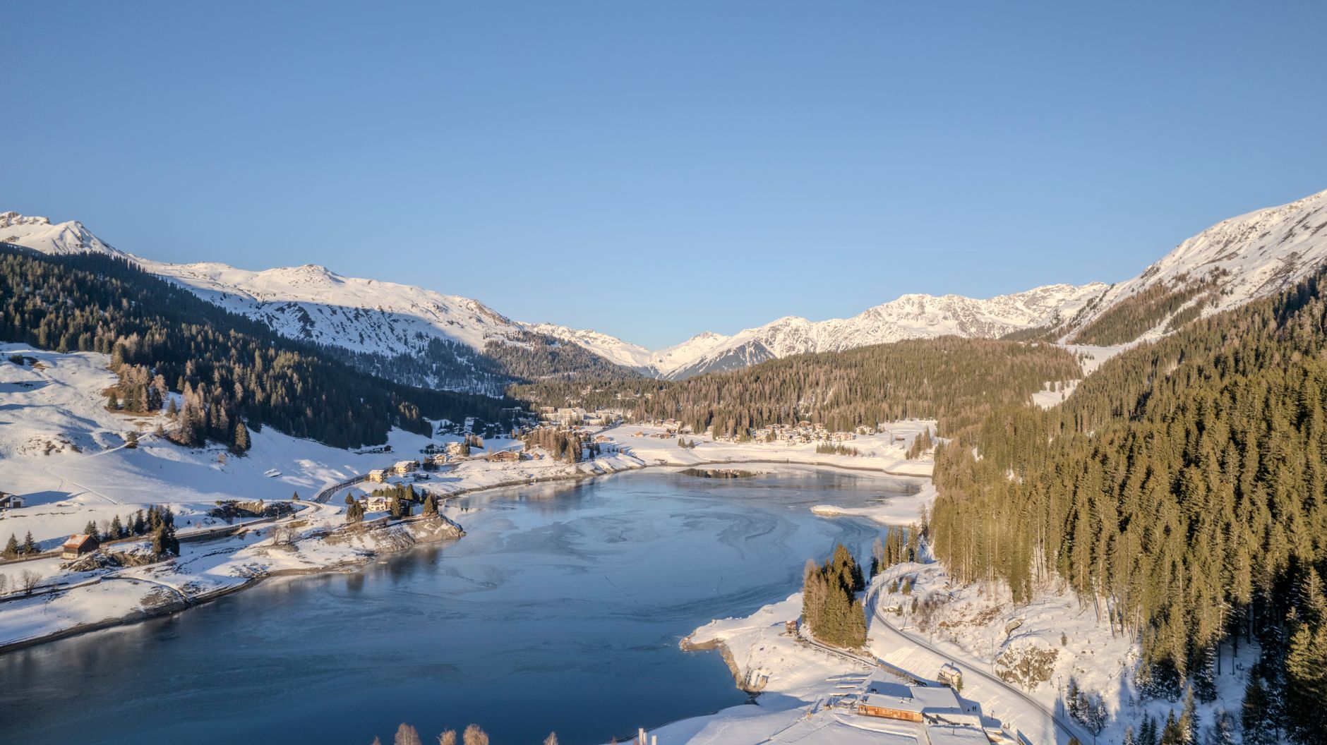 A beautiful winter view of a snow-covered alpine landscape in Davos, Switzerland. — photograph by Ollie Craig on Pexels
